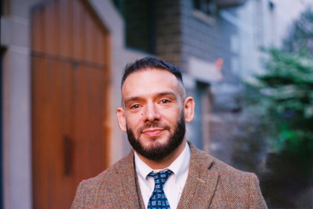 A professional headshot of Dr. Steven Powers, a Philadelphia based Philosophy Professor and Mitigation Specialist in criminal defense for homicide clients